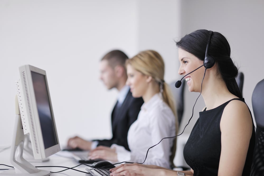 business people group with  headphones giving support in  help desk office to customers, manager giving training and education instructions-3